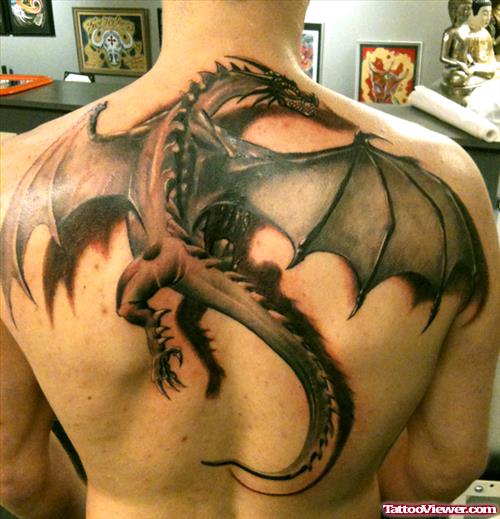Grey Ink Flying Dragon Tattoo On Back