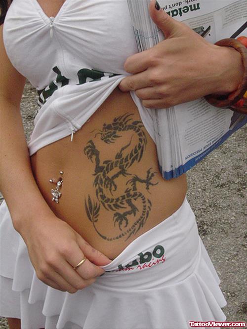 Girl Showing Her Grey Ink Dragon Tattoo