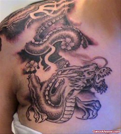 Grey Ink Japanese Dragon Tattoo On Chest