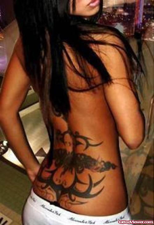 Black Ink Tribal Dragon Tattoo On Lowerback