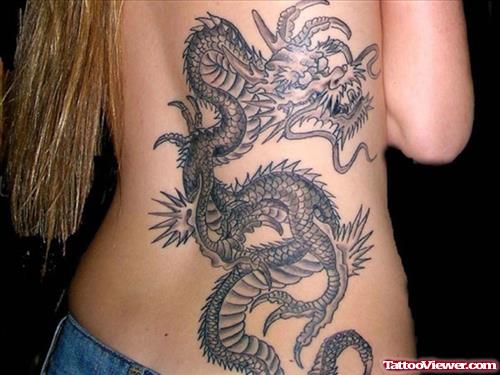 Attractive Grey Ink Dragon Tattoo On Girl Back Body