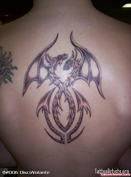 Grey Ink Tribal Dragon Tattoo On Back Body