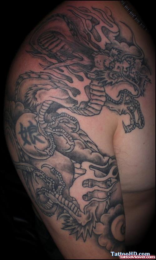 Grey Ink Dragon Tattoo On Chest And Right Shoulder
