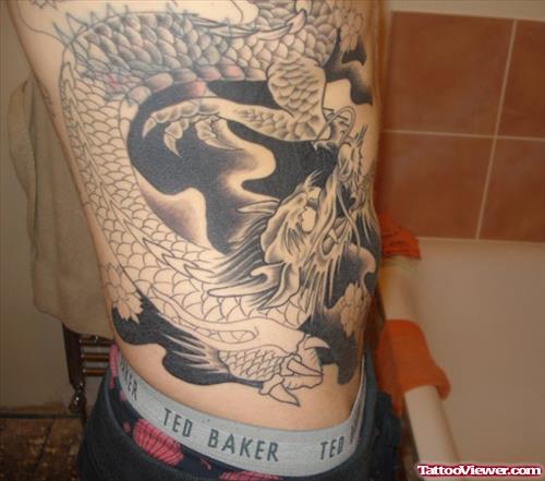 Black And Grey Ink Dragon Tattoo On Side Rib