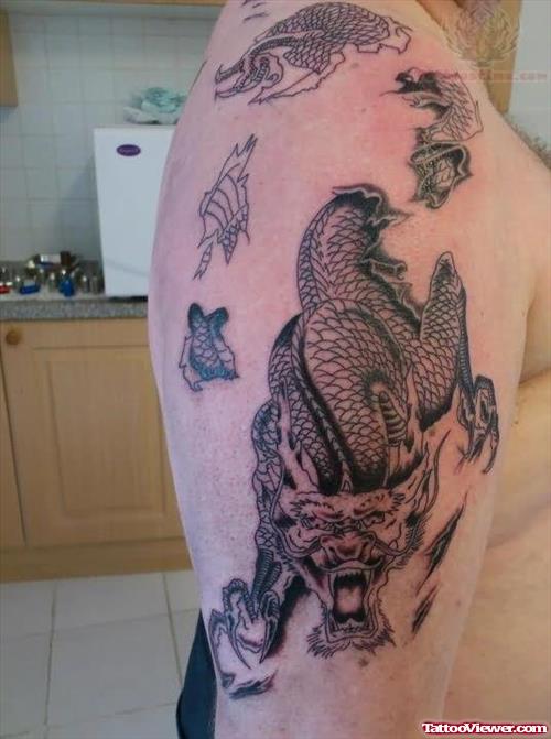 Rip skin Dragon Tattoo On Bicep
