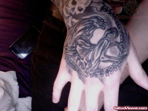 Grey Ink Dragon Skeleton Tattoo On Hand