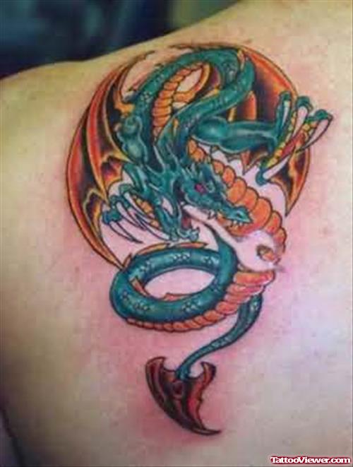 Blue Yellow Dragon Tattoo On Shoulder