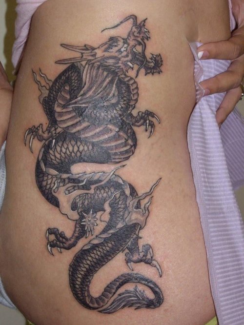 Grey Ink Dragon Tattoo On Girl Side Rib