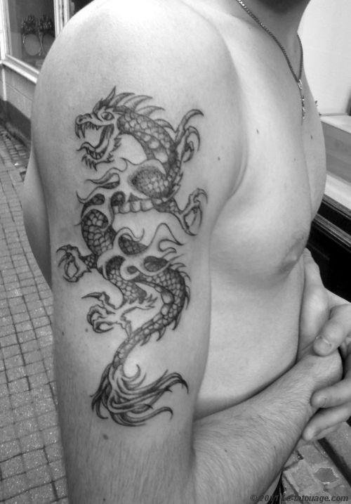 Grey Ink Dragon Tattoo On Man Right Half Sleeve