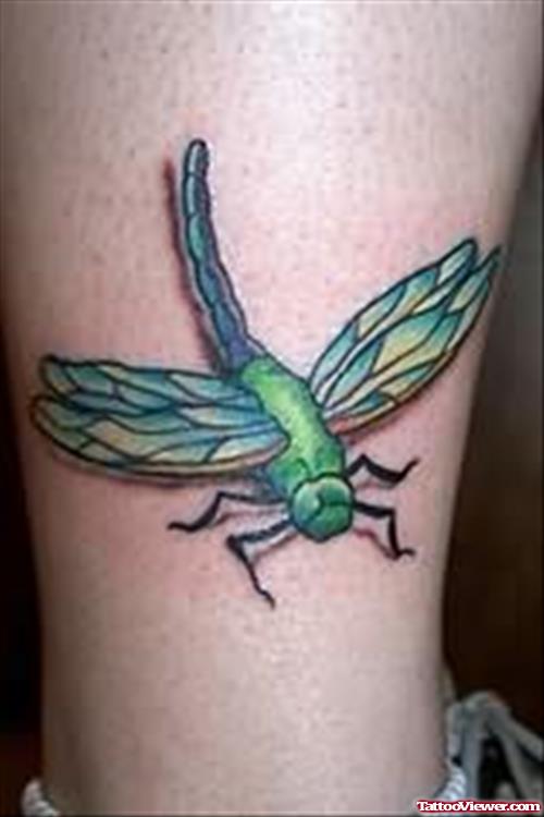 Green Dragonfly Tattoo On Leg