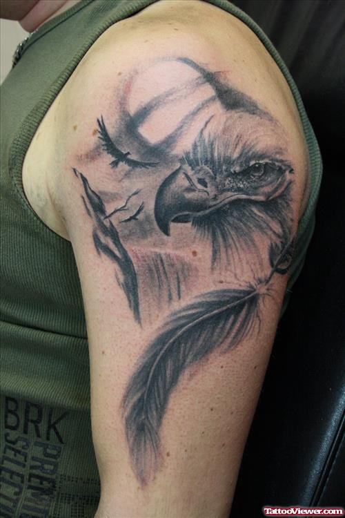 Grey Ink Eagle Head And Feather Tattoo On Left Half Sleeve