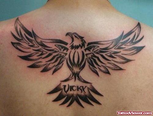Awful Black Ink Tribal Eagle Tattoo On Upperback