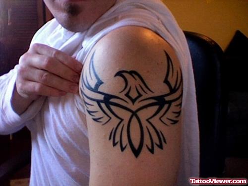 Amazing Black Ink Tribal Eagle Tattoo On Shoulder