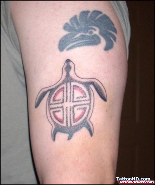 Tribal Eagle Head And Turtle Tattoo On Left Half Sleeve