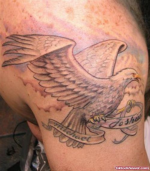 Grey Ink Eagle And Banner Tattoo On Shoulder