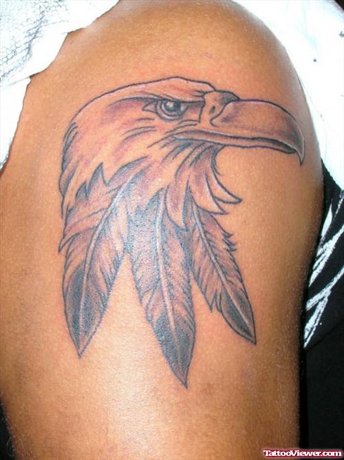 Grey Ink Eagle Head With Feather Tattoo