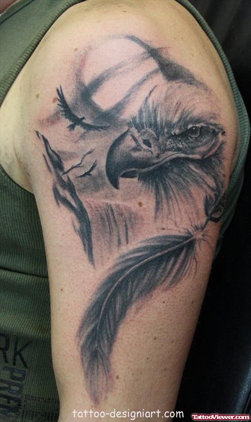 Grey Ink Eagle Head And Feather Tattoo On Left Shoulder