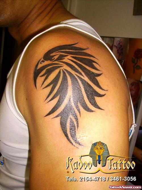 Tribal Eagle Head Tattoo On Man Left Shoulder
