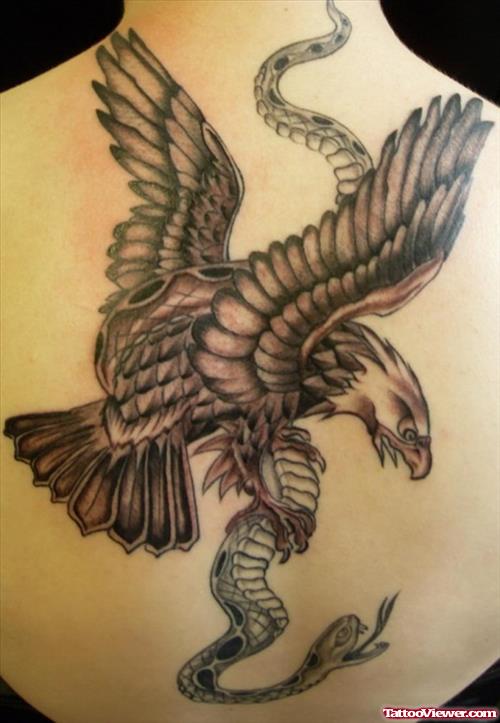 Grey Ink Eagle And Snake Tattoo On Upperback