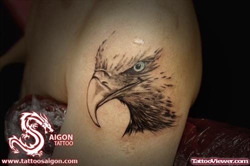 Grey Ink Eagle Head Tattoo On Left Shoulder