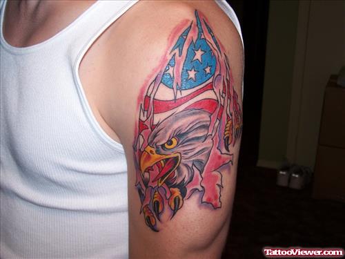 Colored Ripped Skin Eagle Tattoo On Man Left Shoulder