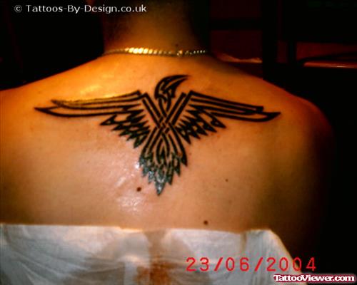 Black Ink Tribal Eagle Tattoo On Upperback