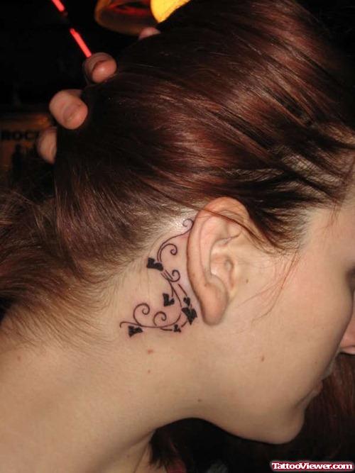 Tiny Black Hearts Back Ear Tattoo
