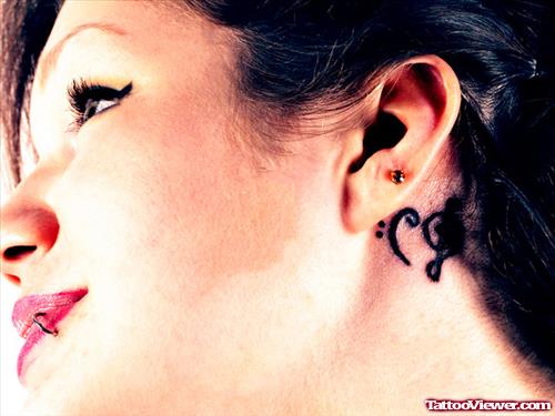 Musical Imprint Below Ear Tattoo