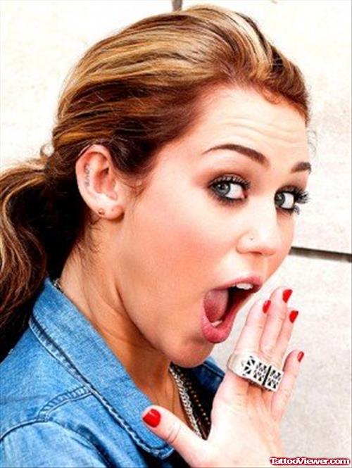 Miley Cyrus Ear Tattoo