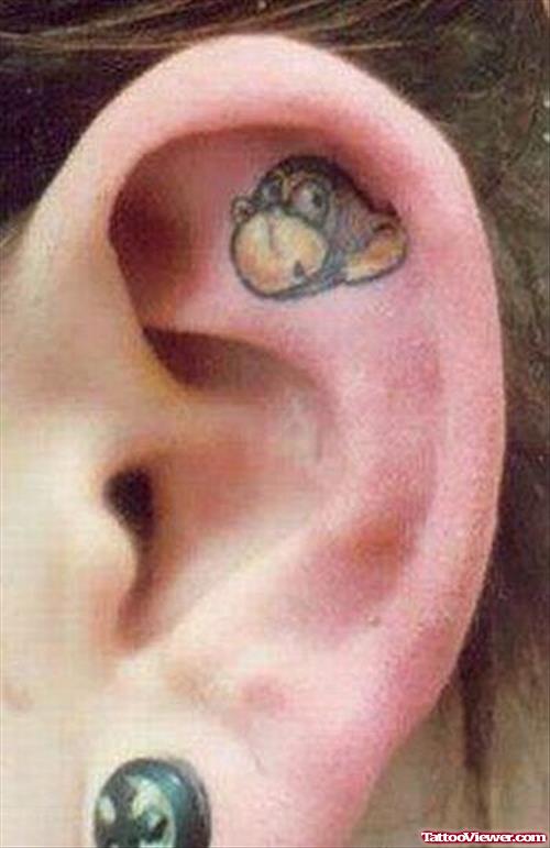 Weird Monkey Head Ear Tattoo