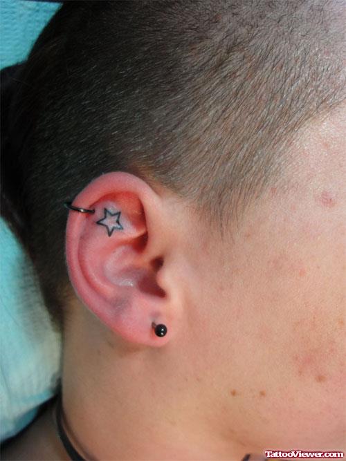 Star Tattoo In Right Ear