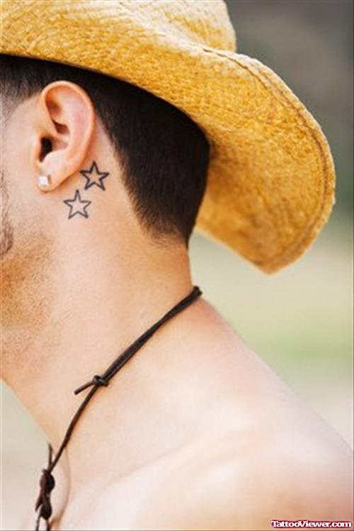 Man With Stars Below Ear Tattoo