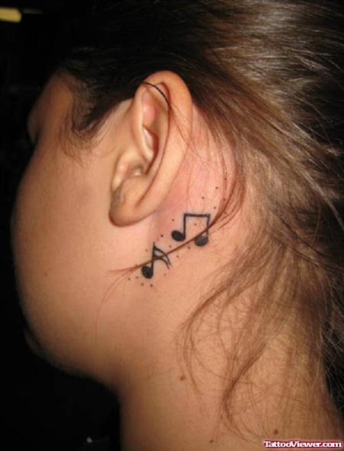 Black Ink Music Notes Back Ear Tattoo