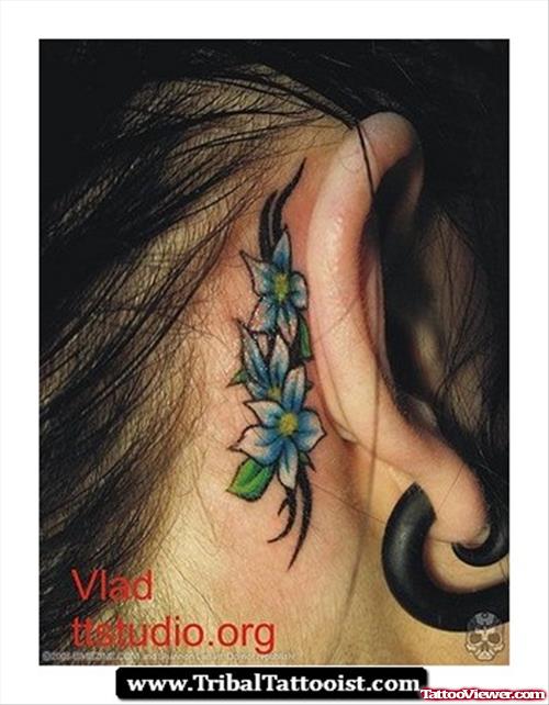 Tribal And Blue Flowers Back Ear Tattoo