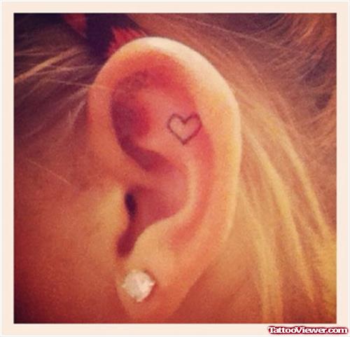 Tiny Heart Tattoo On Girl Left Ear