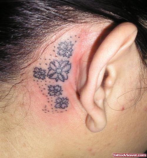 Grey Flower Ear Tattoo
