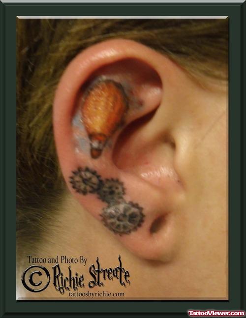 Sprockets And Hot Balloon Tattoo In Ear