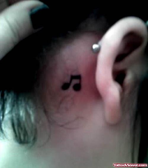 Black Ink Music Note Ear Tattoo