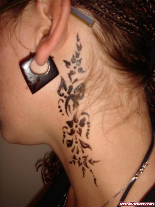 Tribal Flower And Dragonfly Behind Ear Tattoo