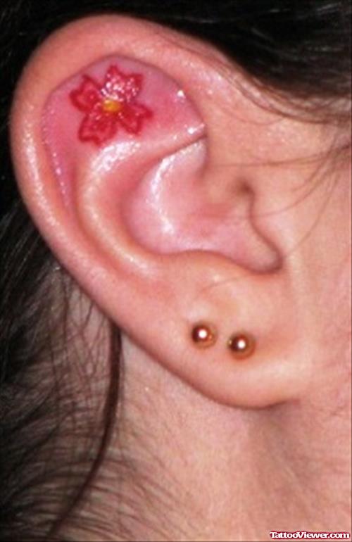 Red Flower Ear Tattoo