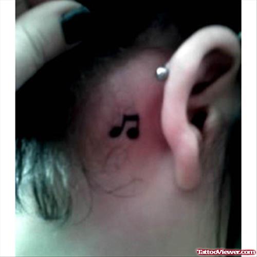 Black Ink Small Music Note Ear Tattoo