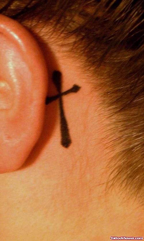 Black Cross Behind Ear Tattoo