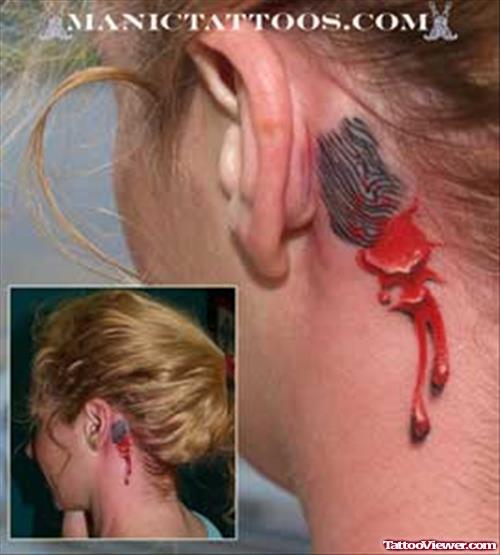 Ripped Skin Bleeding Ear Tattoo