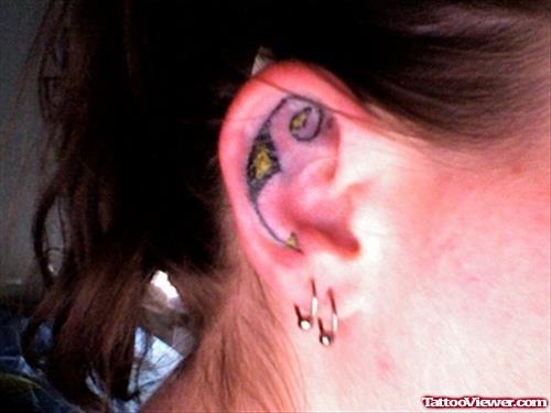 Right Ear Colored Tattoo
