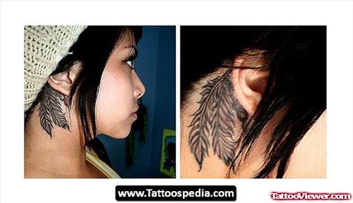 Grey Ink Feather Behind Ear Tattoo