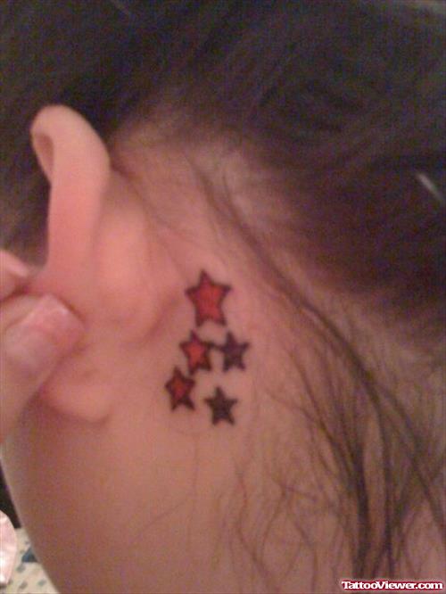 Red Stars Behind Ear Tattoo