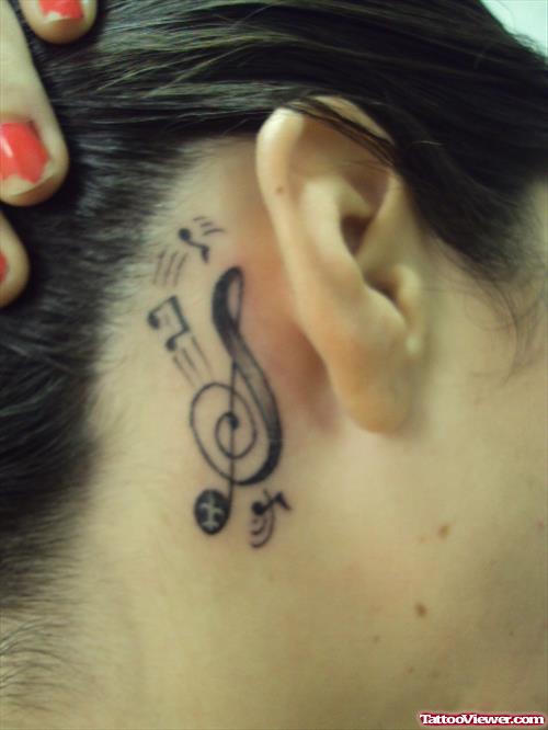 Music Notes And Violen Key Ear Tattoo