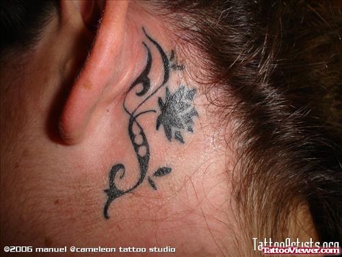Black Ink Tribal Flower Ear Tattoo