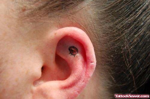 Red Ladybug Ear Tattoo
