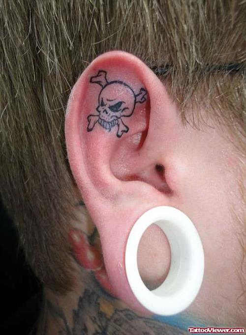 Outline Skull Right Ear Tattoo